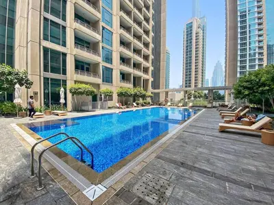 a large swimming pool in the middle of a building at FIRST CLASS 2BR Incredible Burj Khalifa View in Dubai