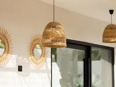 a group of mirrors on a wall next to a window at Unique Beachside Studio, Shared Pool & Burj Khalifa View! in Dubai