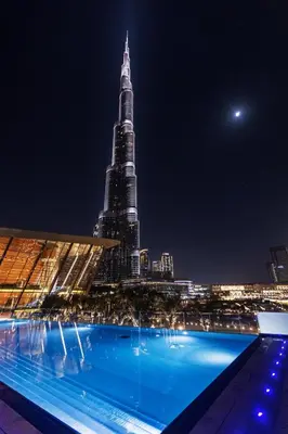a view of the burj khalifa at night at Direct Burj Khalifa View I Minutes Walk to Dubai Mall I Stunning Fountain Views I One Lux Stay Grande Signature Residence in Dubai