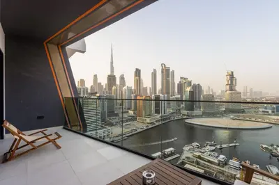 a room with a view of a city skyline at Livbnb-Classy 2B with Jacuzzi & BurjKhalifa View in Dubai