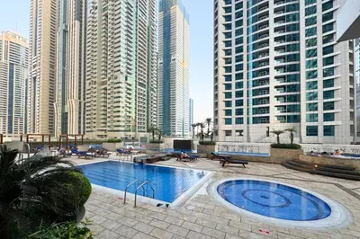 a swimming pool in a city with tall buildings at Dubai Marina FLOOR 89 - AMAZING VIEWS in Dubai