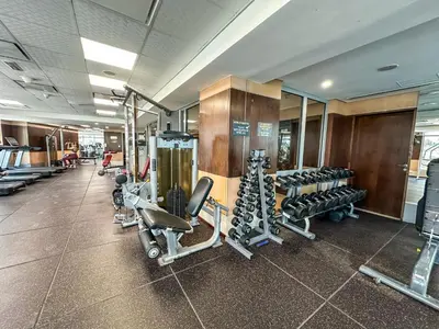 a gym with a lot of treadmills and machines at Luxury 1 Bed with full Marina View - Emaar Park Island in Dubai