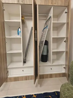 a closet with shelves and skis in it at Room with Kitchen Furnished Apartments by oima leasing property in Dubai