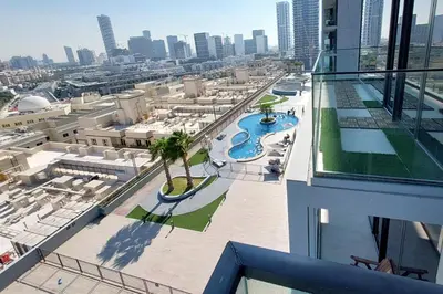 an aerial view of a pool on a building at Bloom Tower C - JVC by Golden Casa in Dubai