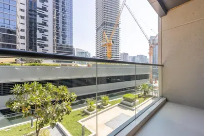 a balcony with a view of a city at Livbnb - 2B Maid's in Dunya, 5Min Walk to Dubai Mall in Dubai