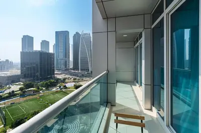a balcony of a building with a view of a city at Urban Oasis 1BR in Armada with Cityscape Views in Dubai