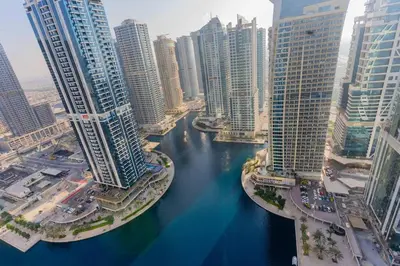 an aerial view of a river in a city with tall buildings at JLT Nice Studio apartment High floor View in Dubai