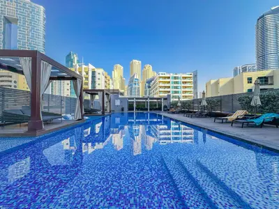a large swimming pool on top of a building at Super Luxury Flat Desing with Sea, Marina and Pool View in Dubai