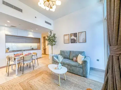 a living room with a couch and a table at Super Luxury Flat Desing with Sea, Marina and Pool View in Dubai