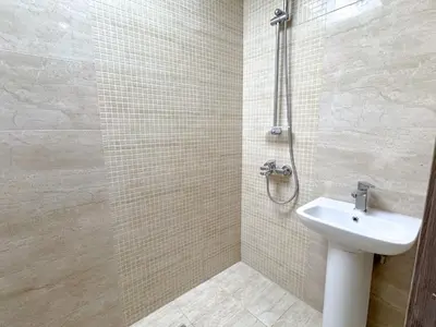 a bathroom with a sink and a shower at Barsha Star Residence 2-HomeStay in Dubai