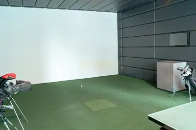 a room with a camera and a room with green carpet at Luxurious 3Bedroom Apartment in Dubai