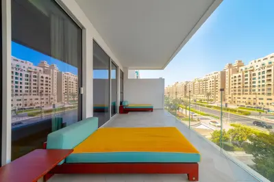 a room with a bed and a large window at Superluxury Apartment in FIVE Palm, Pool & Beach Access in Dubai
