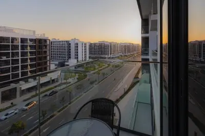 a view of a city street from a balcony at Brand New Studio Near Downtown Dubai in Dubai