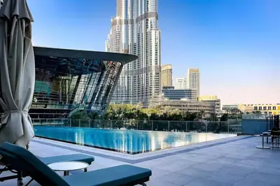 a view of a swimming pool on the roof of a building at Full Burj Khalifa & Fountain View All Rooms in Dubai
