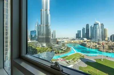 a window with a view of a city skyline at The View of a Lifetime - Luxury Living with Full Burj Khalifa & Fountain Show in Dubai