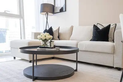 a living room with a couch and a table at DownTown, Amazing Business Bay Skyline Views in Dubai