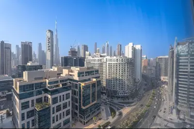an aerial view of a city with tall buildings at DownTown, Amazing Business Bay Skyline Views in Dubai