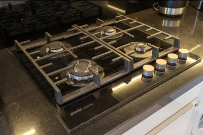 a stove top oven sitting on a kitchen counter at DownTown, Amazing Business Bay Skyline Views in Dubai
