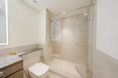 a bathroom with a shower and a toilet at Forte Luxe - Stylish 2BR Downtown Escape in Dubai