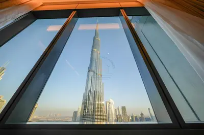 a window with a view of the tallest building in the world at 3 BHK Luxury Living at The Address Opera in Dubai