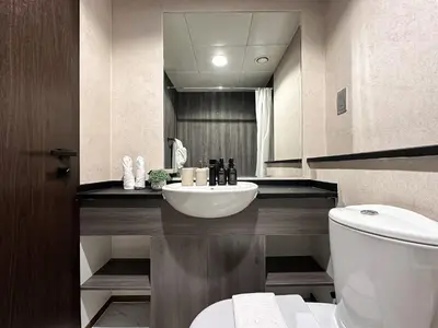 a bathroom with a sink and a toilet at Trophy- Radiant Retreat in JLT With Skyline View in Dubai