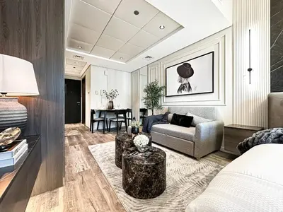 a living room with a couch and a table at Trophy- Radiant Retreat in JLT With Skyline View in Dubai