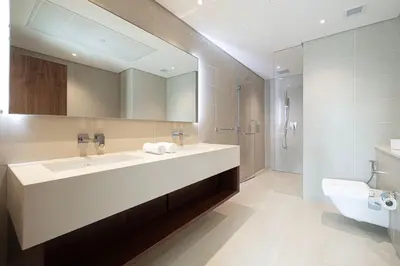 a bathroom with a large sink and a toilet at 3BR Full Marina View for 8 Near The Metro! in Dubai