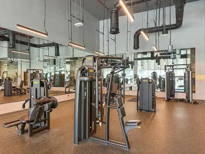 a gym with several treadmills and exercise bikes at Luxury 3BR and Maid room Forte Tower 1 with Fountain View in Dubai