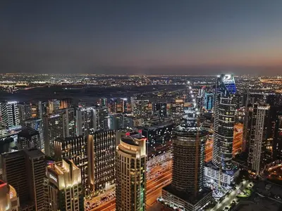 an aerial view of a city at night at Stunning 2BR Apt Burj Royale 10 mins walk to Dubai mall in Dubai