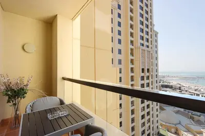 a balcony with a table and a view of a city at Upgraded 1B with Beach Access and Ain Dubai Views in Dubai