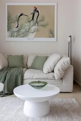 a living room with a couch and a white table at Cosy Apartment Marina Gate in Dubai