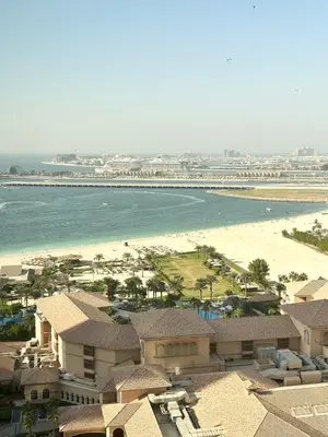 an aerial view of a beach and a resort at Breathtaking Sea and Palm View Spacious Studio with Vibrant Vibes in JBR By SWEET HOMES in Dubai