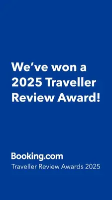 a blue sign that says weve won a traveler review award at Breathtaking Sea and Palm View Spacious Studio with Vibrant Vibes in JBR By SWEET HOMES in Dubai