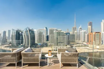a balcony with chairs and a view of a city at GuestReady - Urban retreat at 15 Northside in Dubai