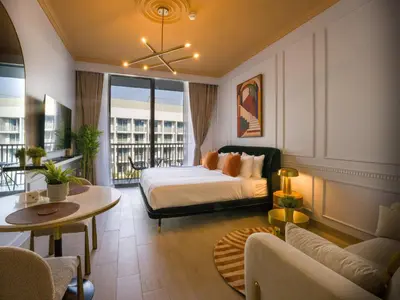 a hotel room with a bed and a balcony at EasyGo - Modern STU- Luma22- JVC in Dubai