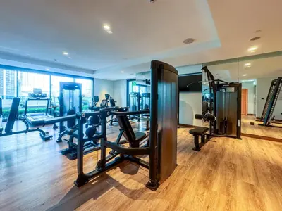 a gym with treadmills and machines in a room at Luxury Downtown 3 Bed with Full Burj Khalifa Views in Dubai