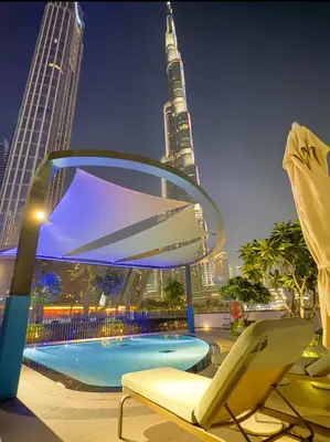 a view of the burj khalifa from the rooftop of a building at New 2 Bedroom apartment overlooking Burj Khalifa and fountain view in downtown in Dubai