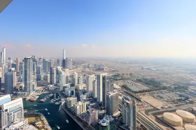 an aerial view of a city with tall buildings at Stunning 1BR with Marina View And Beach Access in Dubai