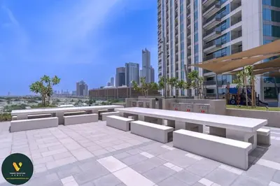 a row of benches on a sidewalk in a city at Vogue Downtown Views II with Direct Access to Dubai Mall Via a Climate Controlled Bridge, Two Bedroom Apartment with Balcony and Burj Khalifa View in Dubai