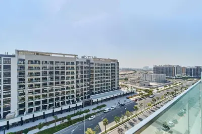 an aerial view of a large building with a street at Chic Studio in Azizi Riviera with Modern Amenities in Dubai