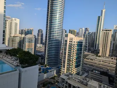 a view of a large city with tall buildings at Stunning 2BR Apartment with Full Marina View in Dubai