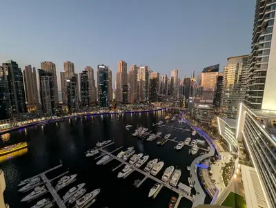 a group of boats in a marina in a city at Stunning 2BR Apartment with Full Marina View in Dubai