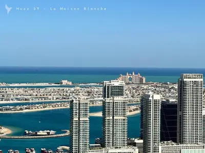 an aerial view of a city with tall buildings at Huzz 59 - La Maison Blanche in Dubai