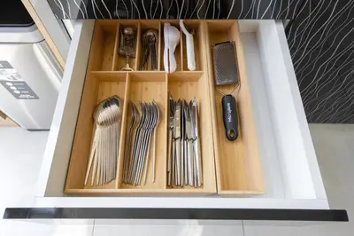 a drawer filled with wooden utensils in a box at Exclusive Marina Stay - Posh 3BR with Stunning Views in Dubai