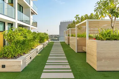 an internal garden on the side of a building at Savis Home - Enjoy the City Skyline View 1BR in Binghatti Venus JVC in Dubai
