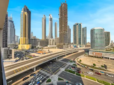 a view of a city with traffic on a highway at Chic 2BR near Dubai Mall & Burj l Canal & City view I 5 pax in Dubai