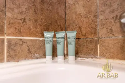 a group of three products sitting on top of a bath tub at Hamilton Residence - Luxury 1BR - Stunning Dubai Canal View - Near Dubai Mall & Burj Khalifa in Dubai