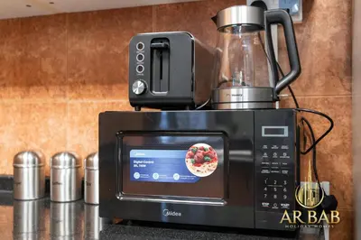a blender sitting on top of a microwave at Hamilton Residence - Luxury 1BR - Stunning Dubai Canal View - Near Dubai Mall & Burj Khalifa in Dubai
