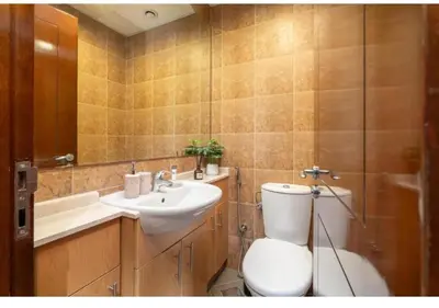 a bathroom with a toilet and a sink at Hamilton Residence - Luxury 1BR - Stunning Dubai Canal View - Near Dubai Mall & Burj Khalifa in Dubai