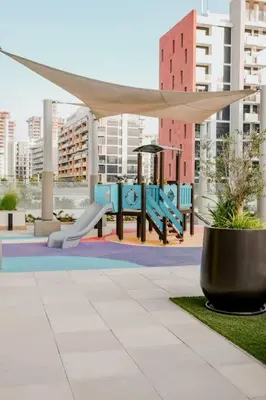 a pavilion with a canopy in a city with buildings at Cozy Studio with Garden Views in Nad Al Sheba in Dubai